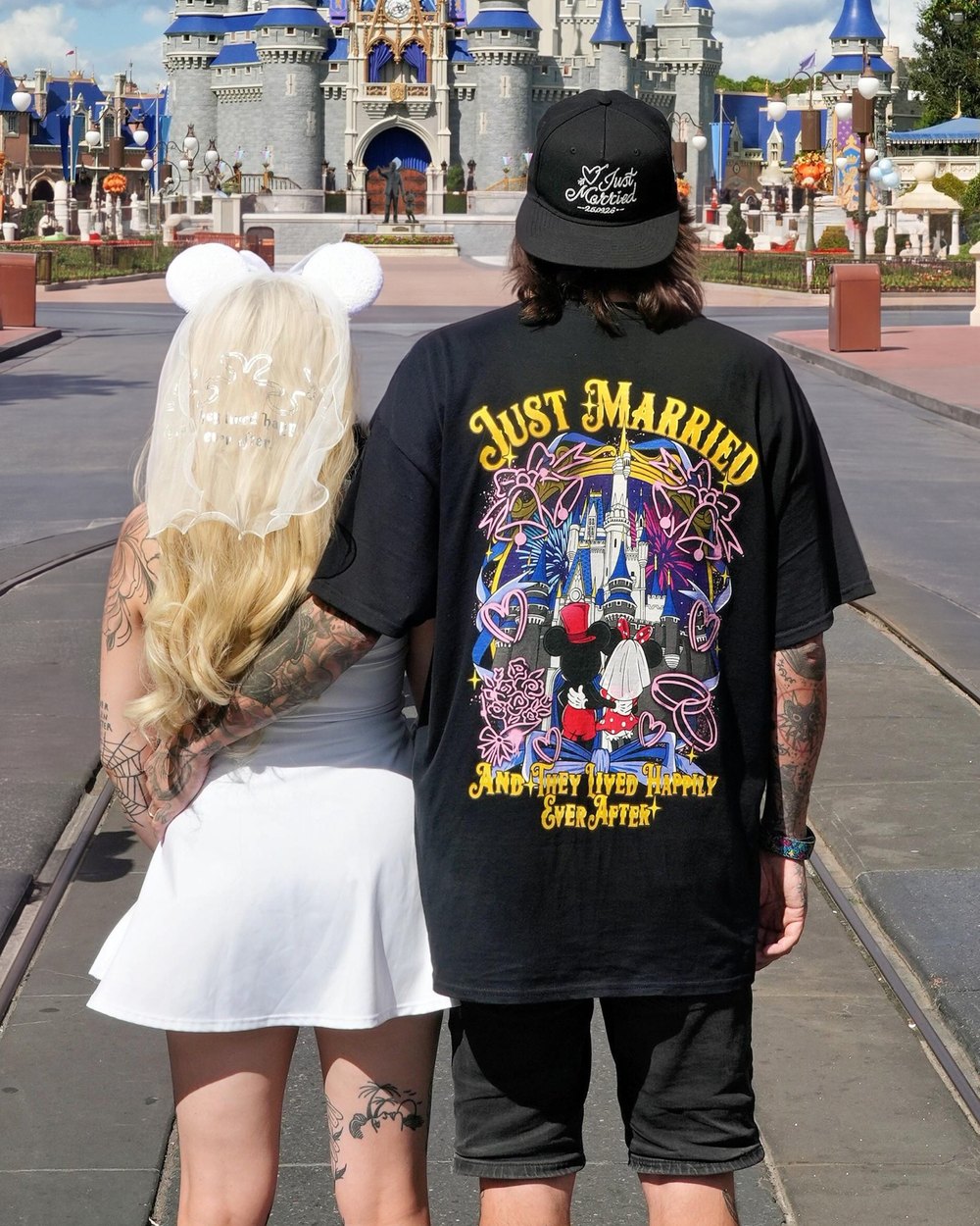 A couple in matching Mouse House tees