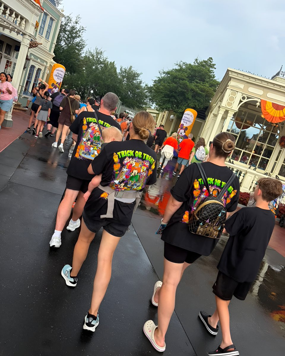 A big group walking down the street in Mouse House tees