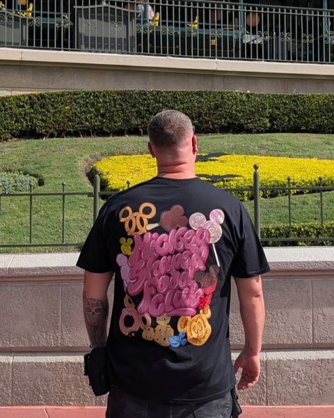 Someone wearing a Mouse House design in a theme park