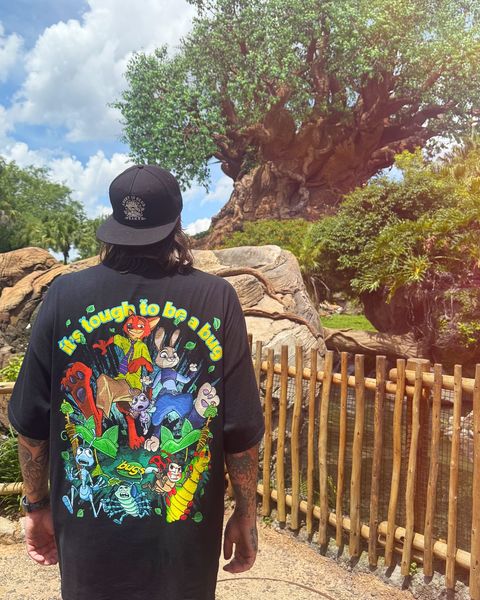 Someone wearing a Mouse House design in a theme park