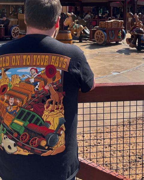 Someone wearing a Mouse House design in a theme park