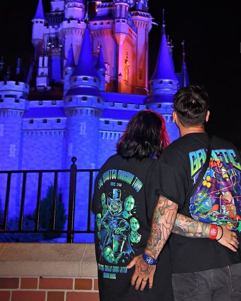 Someone wearing a Mouse House design in a theme park