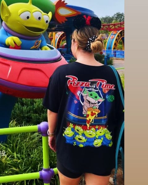 Someone wearing a Mouse House design in a theme park