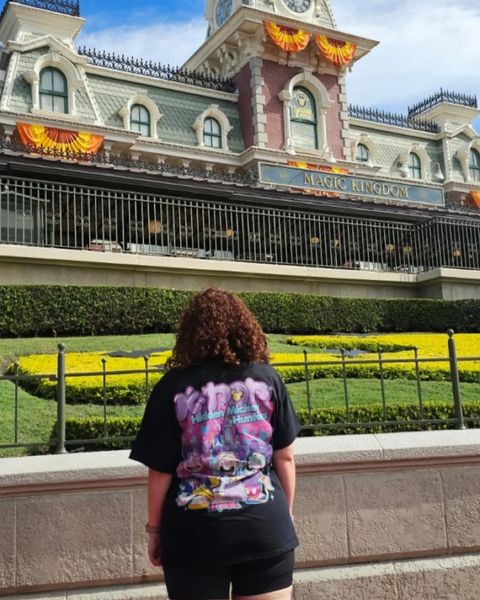 Someone wearing a Mouse House design in a theme park