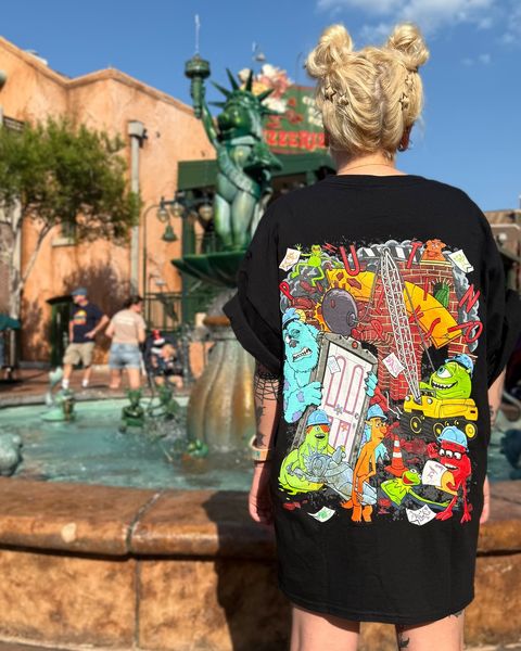 Someone wearing a Mouse House design in a theme park