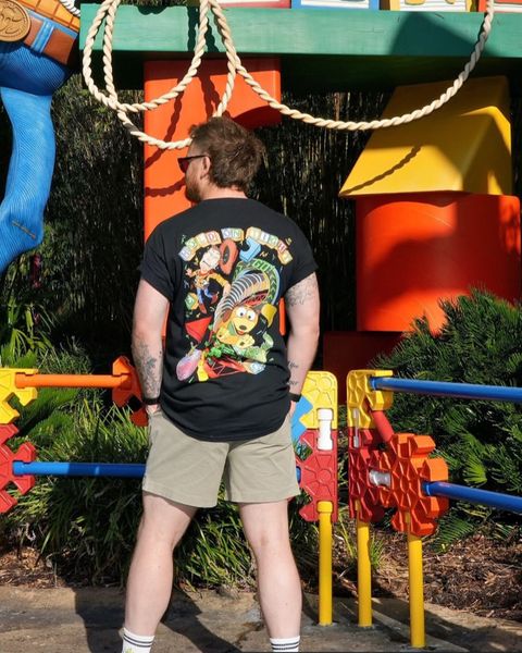 Someone wearing a Mouse House design in a theme park