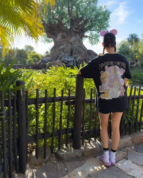 Someone wearing a Mouse House design in a theme park