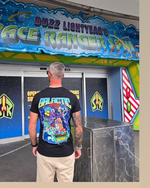 Someone wearing a Mouse House design in a theme park