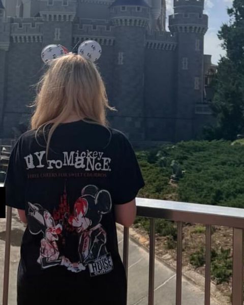 Someone wearing a Mouse House design in a theme park