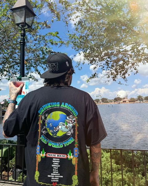 Someone wearing a Mouse House design in a theme park