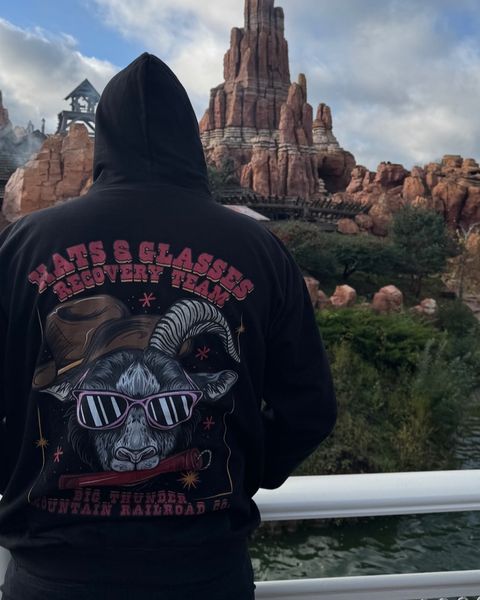 Someone wearing a Mouse House design in a theme park