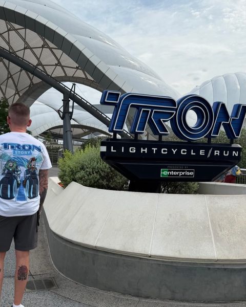 Someone wearing a Mouse House design in a theme park
