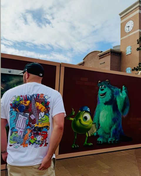 Someone wearing a Mouse House design in a theme park
